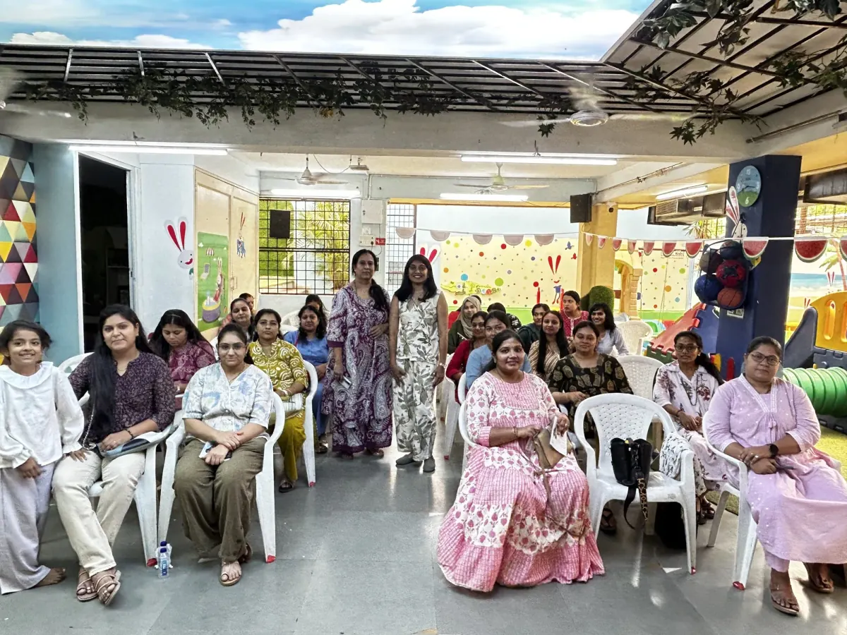 Zalak with parents and children at a parenting workshop